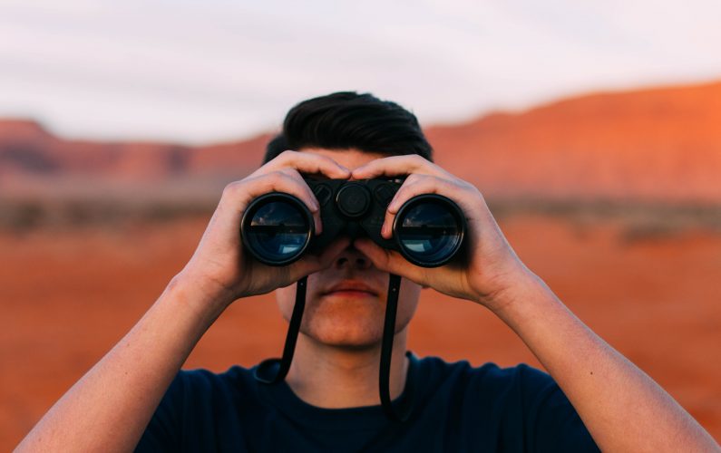 Canva - Man Looking Through Binoculars